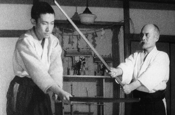 Kisshomaru Ueshiba with his father