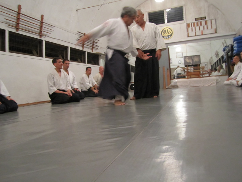 Takeshi Yamashima sensei and Glenn Yoshida (Aikido Renshinkan) at the Windward Aikido Club on Oahu in Kaneohe Hawaii. Chris Li translating on left. windward-aikido-yamashima-yoshida-2.jpg