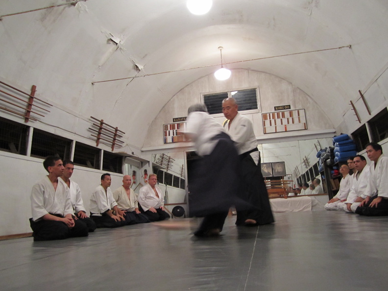 Takeshi Yamashima sensei and Glenn Yoshida (Aikido Renshinkan) at the Windward Aikido Club on Oahu in Kaneohe Hawaii. Chris Li translating on left. windward-aikido-yamashima-yoshida.jpg